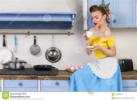 Retro Pin Up Woman Housewife Sitting In The Kitchen Stock Photo Image