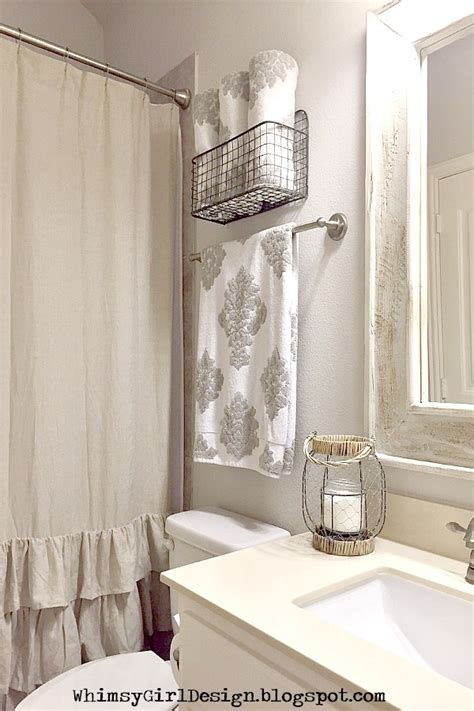 If you don't have a separate place to hang a hand towel, consider adding a smaller bar or ring near the sink. whimsy girl: Styling Tips: {Decorative Solutions for Towel ...