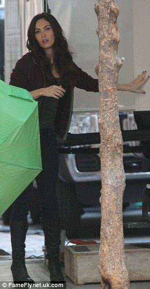 Megan Fox Shields Her Newly Red Locks With The Aid Of An Umbrella