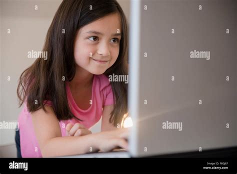 Smiling Girl Using Laptop Stock Photo Alamy