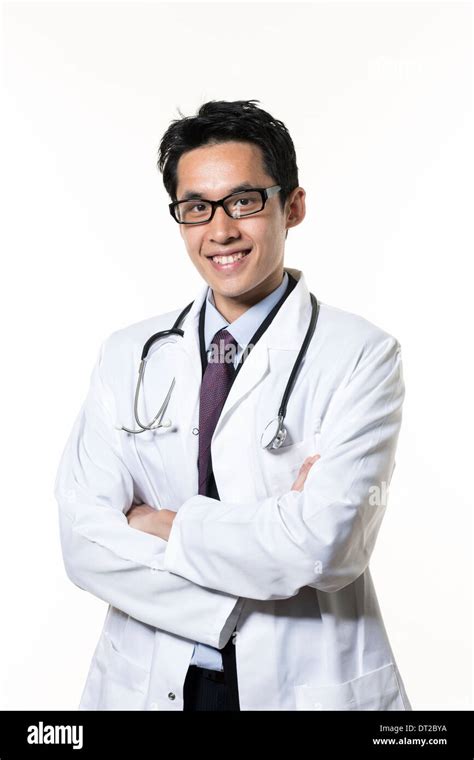 Portrait Of A Male Asian Doctor Wearing White Coat And Stethoscope Isolated On White Background
