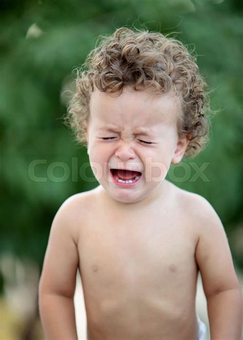 Sad Baby With Curly Hair Crying Stock Image Colourbox