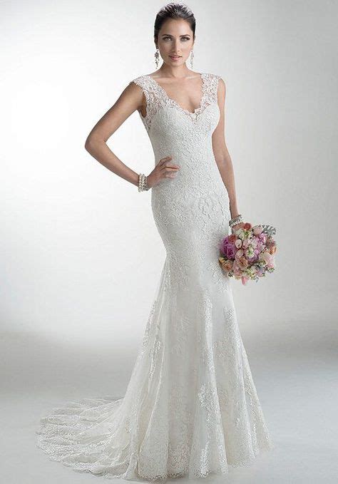 Delicate corded lace on tulle skims the shoulders and neckline of this 