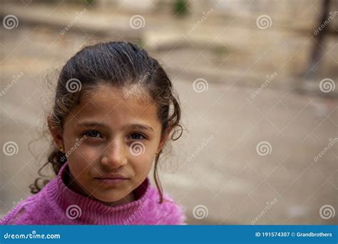 Portrait Of A Pretty Syrian Girl In A Poor Neighborhood Editorial