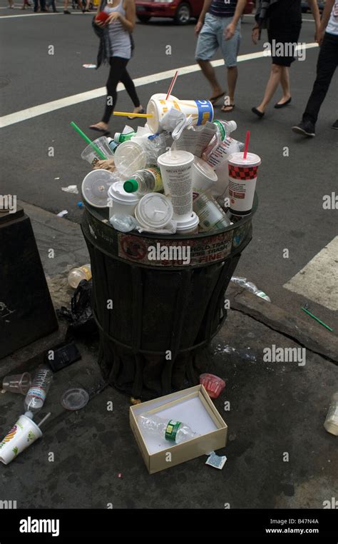 An Overflowing Trash Can In New York Stock Photo Royalty Free Image