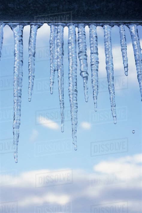 Close Up Of Icicles On Roof Edge Stock Photo Dissolve