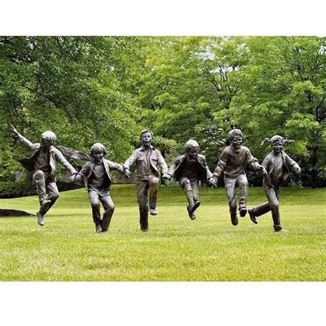 A Group Of Life Size Children Garden Statues