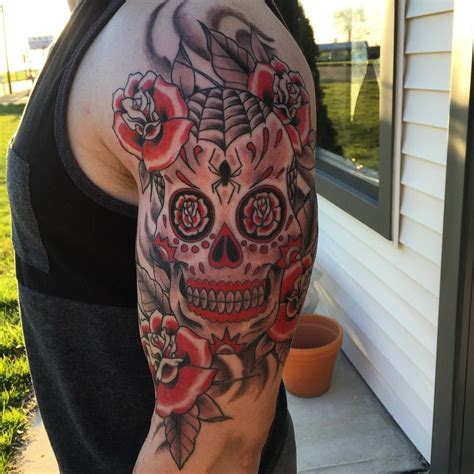 Sugar Skull Tattoo On Mans Shoulder With Rose And Spider