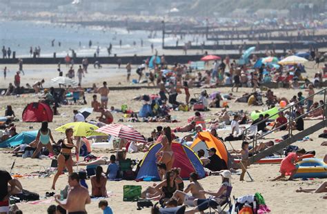 Uk Weather Crowds Hit Beaches Despite Lockdown As Met Office Confirms Hottest Day Of The Year