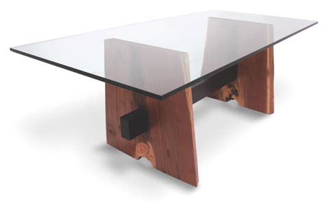 Check spelling or type a new query. One of Rotsen's glass top dining tables made in combination with solid walnut slabs, this piece ...