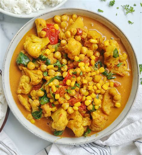Cauliflower Chickpea Curry With Spinach Tomatoes And Corn