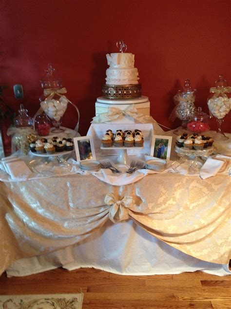 A Table Topped With Lots Of Different Types Of Cakes And Cupcakes On