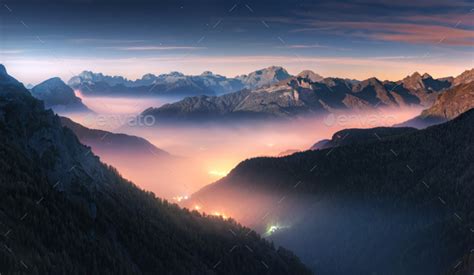 Mountains In Fog At Beautiful Night In Autumn In Dolomites