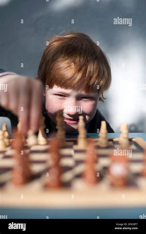 Smiling Redhead Boy Playing Chess Stock Photo Alamy