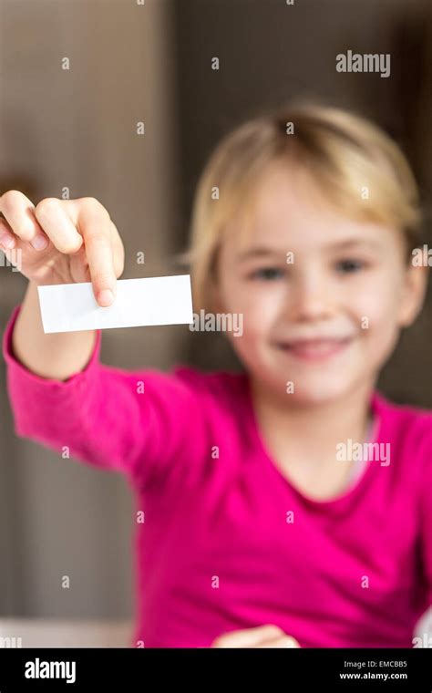 Girl Holding Blank Piece Of Paper Stock Photo Alamy