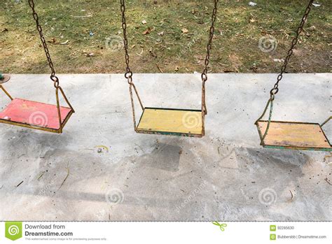 Closeup Of Colorful Swings In Playground Area At Park Stock Photo