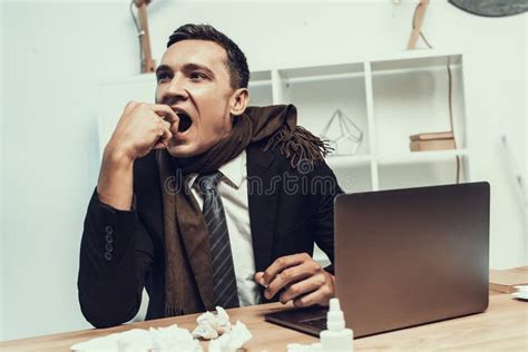 Sick Man In Suit With Scarf Sitting In Office Stock Photo Image Of