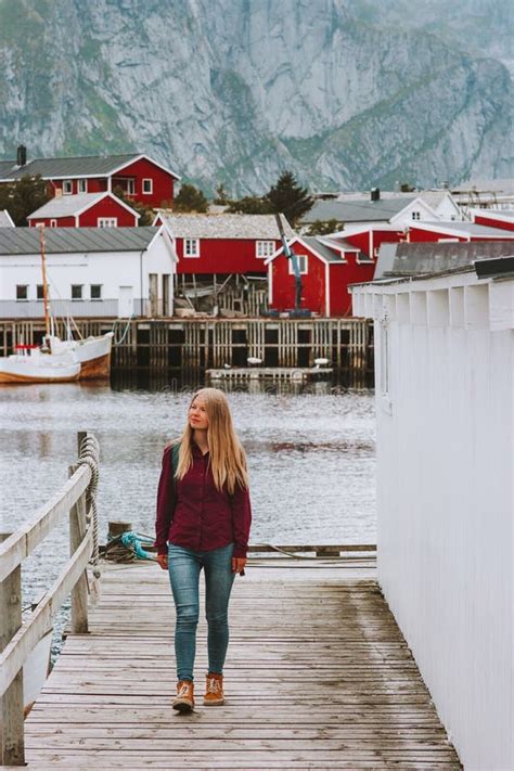 Tourist Woman Walking Sightseeing Lofoten Islands Village In Norway