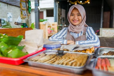 Woman With Hijab Working In Her Tradtional Food Stall Stock Image