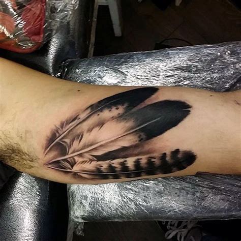 Top 101 Inner Bicep Tattoo Ideas [2021 Inspiration Guide] Indian Feather Tattoos Inner