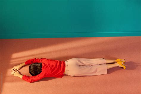 Woman Lying Face Down On The Floor Of A Room By Stocksy Contributor Ulas Merve Stocksy