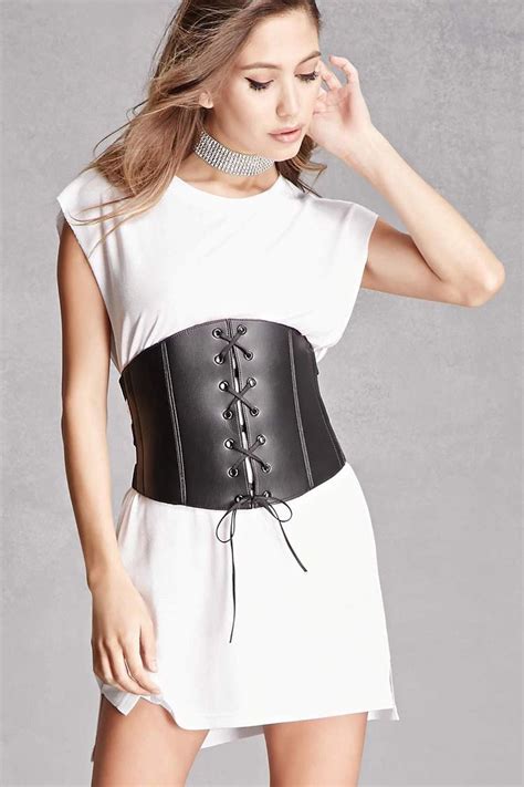 A Faux Leather Corset By Kikiriki Featuring Strapped Sides Hook Back