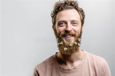 Handsome Hipster Man With Beard Smiling At Camera Over White Background