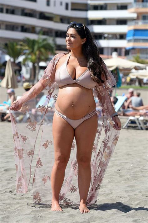 Casey Batchelor Shows Off Her Baby Bump In A Pastel Pink Bikini While On The Beach In Tenerife