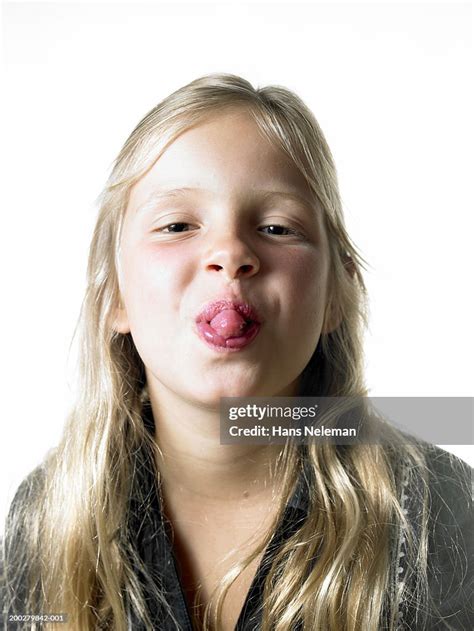 Girl Sticking Out Tongue Portrait Closeup High Res Stock Photo Getty