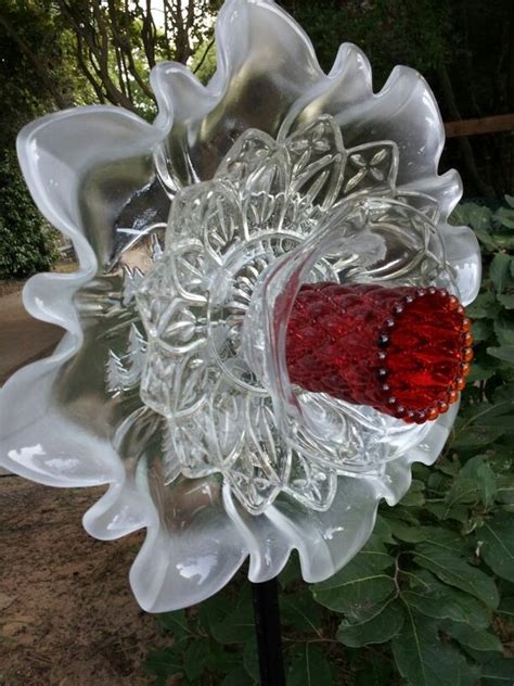 Glass garden flowers made out of recycled glass dishes and plates. Glass garden art, Garden art, Yard art