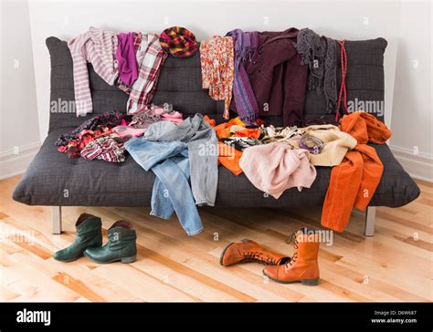 What To Wear Messy Colorful Clothing On A Sofa Stock Photo Alamy