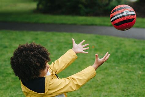 Careful Black Boy Catching Ball · Free Stock Photo