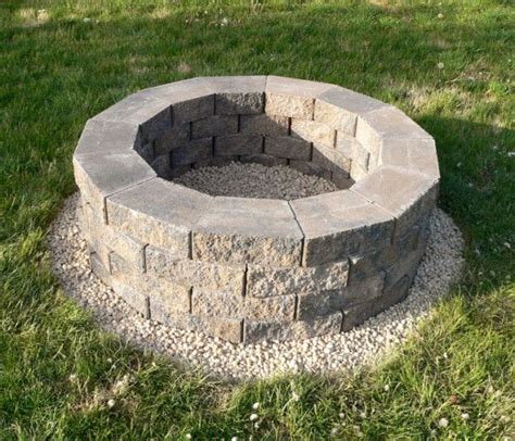 Build up the fire pit wall according to zillow, continue stacking bricks until the wall of your fire pit is about one foot taller than ground level. Build your own fire pit. This is much better than Connor's ...