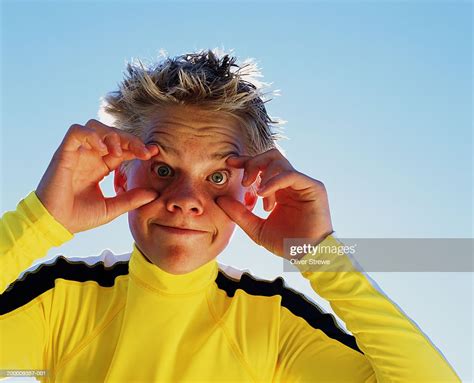 Young Man Holding Eyes Open Wide Portrait High Res Stock Photo Getty