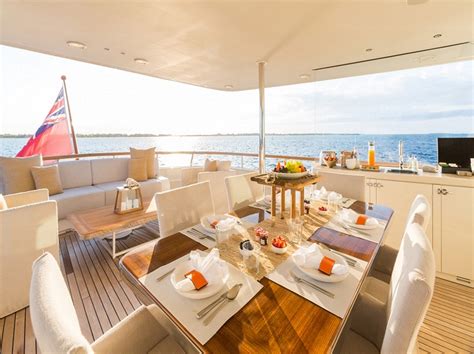 Motor Yacht Pioneer Alfresco Dining And Lounging On The Upper Aft