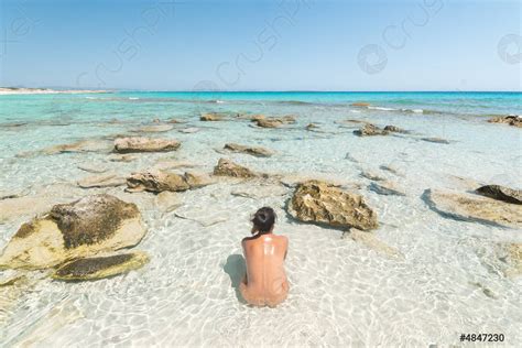 Nude Female Sitting In Sea On Shore Stock Photo Crushpixel