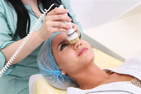 Hardware Cosmetology Cleaning The Skin With A Brush Stock Photo