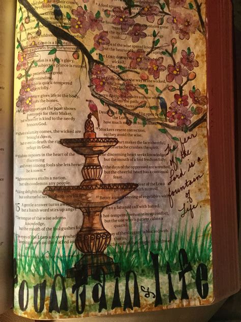 An Open Book With Water Fountain And Flowers On The Pages In Front Of