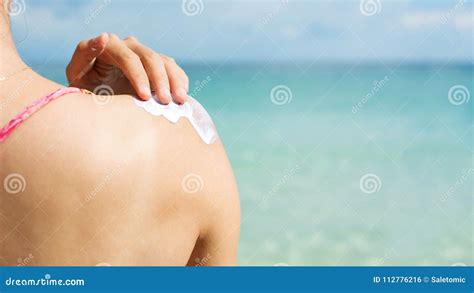Girl Applying Sun Lotion On The Beach Stock Photo Image Of Spread People