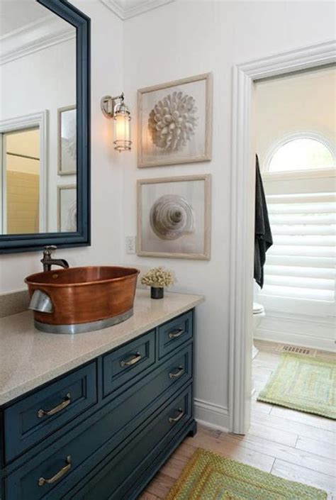 This decor includes the mirror, curtains, flooring, washbasin. 15 Beach Themed Bathroom Design Ideas - Rilane