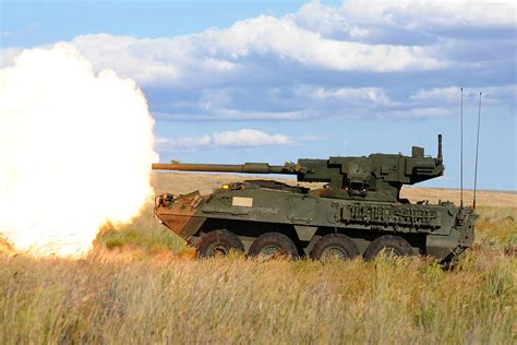 M1126 Stryker Firing 105 Mm Cannon Mixed Media By L Brown Pixels