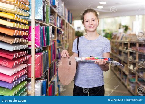 Cute Tween Girl Holding Stack Of School Stationery In Shop Stock Image