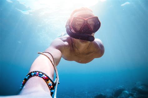 underwater diving snorkeling selfie in the sea shade tree