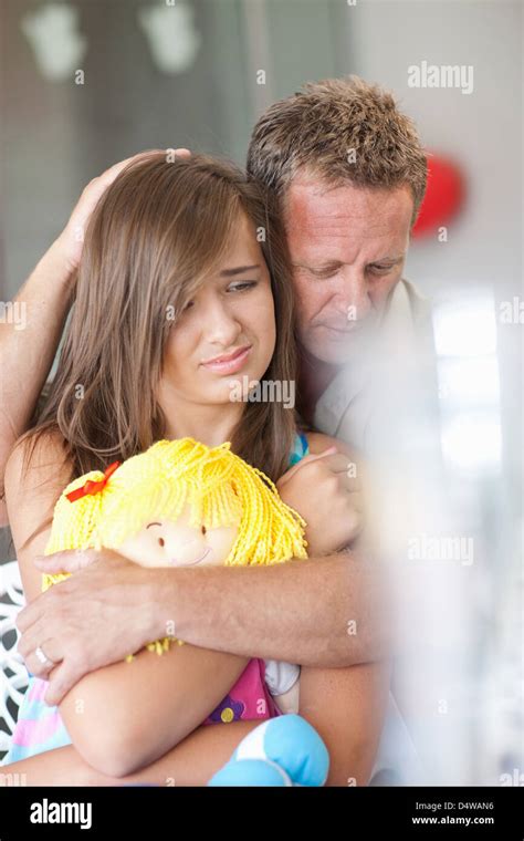 Father Comforting Teenage Daughter Stock Photo Alamy