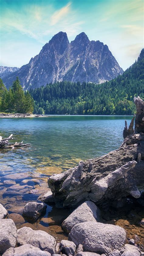 Lake With Clear Water And Stones In Background Of Mountain 4k Hd Nature
