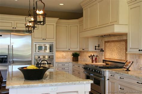 Chocolate wood flooring in this kitchen blends well with the antique white kitchen cabinet. Pictures of Kitchens - Traditional - Off-White Antique Kitchens (Kitchen #1)