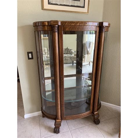 Antique Tiger Oak Curved Glass Mirrored Back Curio Cabinet On Claw Feet