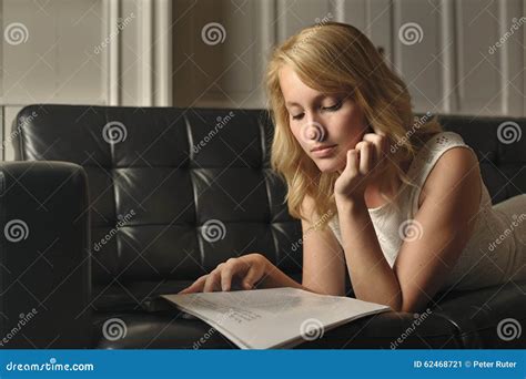 Blonde Woman Lying On The Couch Reading Stock Image Image Of Panel