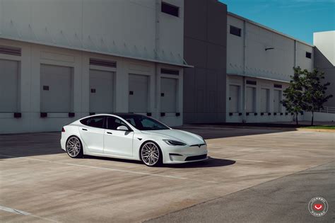 White Tesla Model S Plaid Gets An Attitude Adjustment License Plate