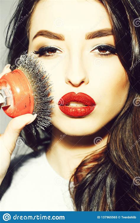 Woman With Red Lips Long Hair Holds Iron Brush Stock